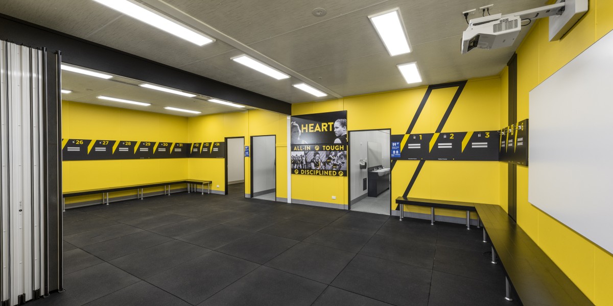 Yellow Sports Change Room with Bifold Doors and Benches