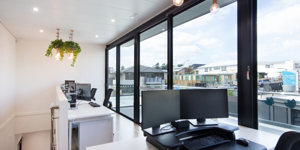 Interior Office with Desks, Computers and Chairs with Glass Doors