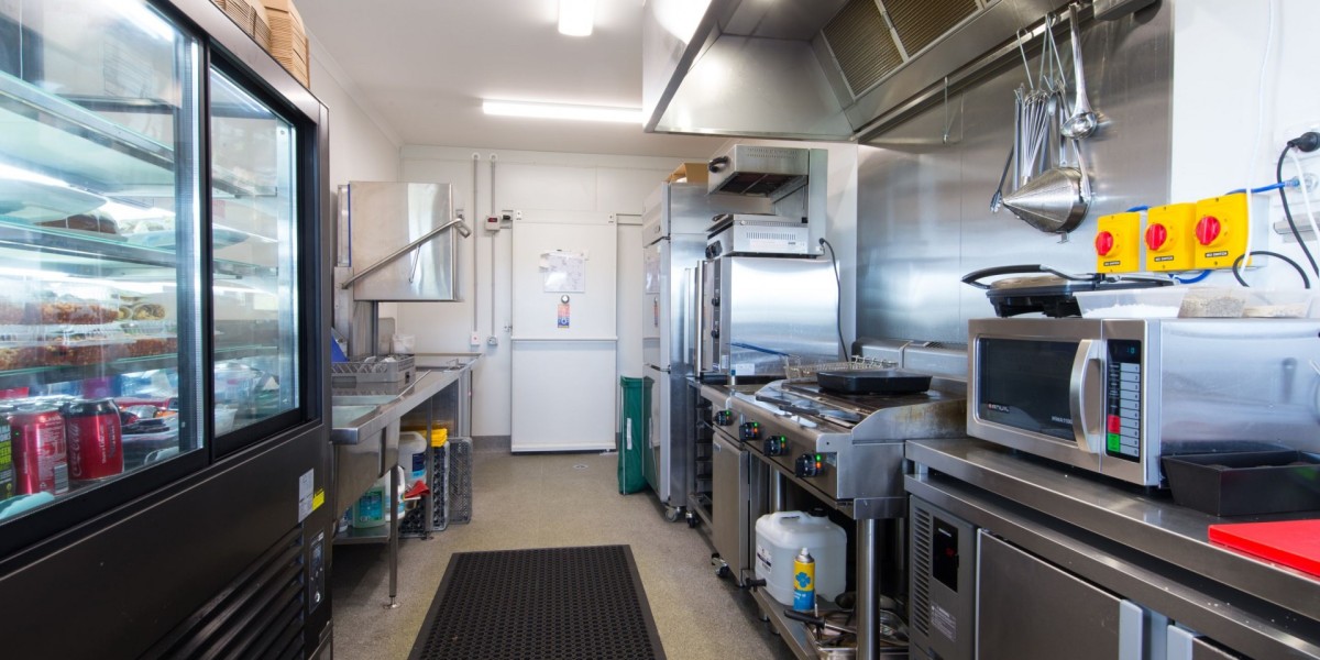 Interior Commercial Kitchen with Appliances and Fridges