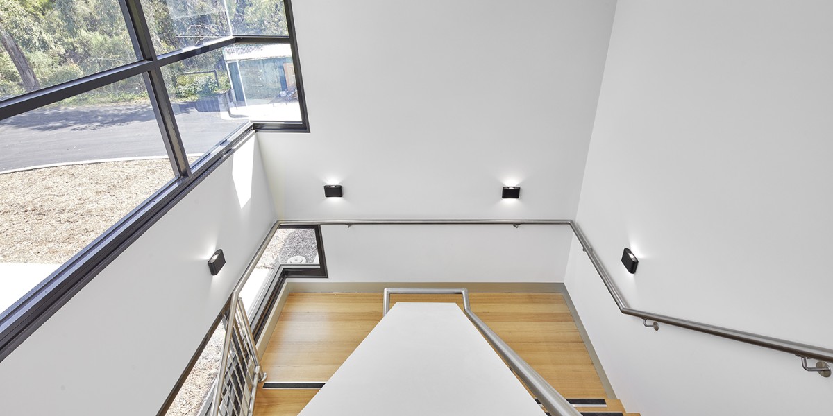 Internal Two-Level Stairway with White Walls and Window