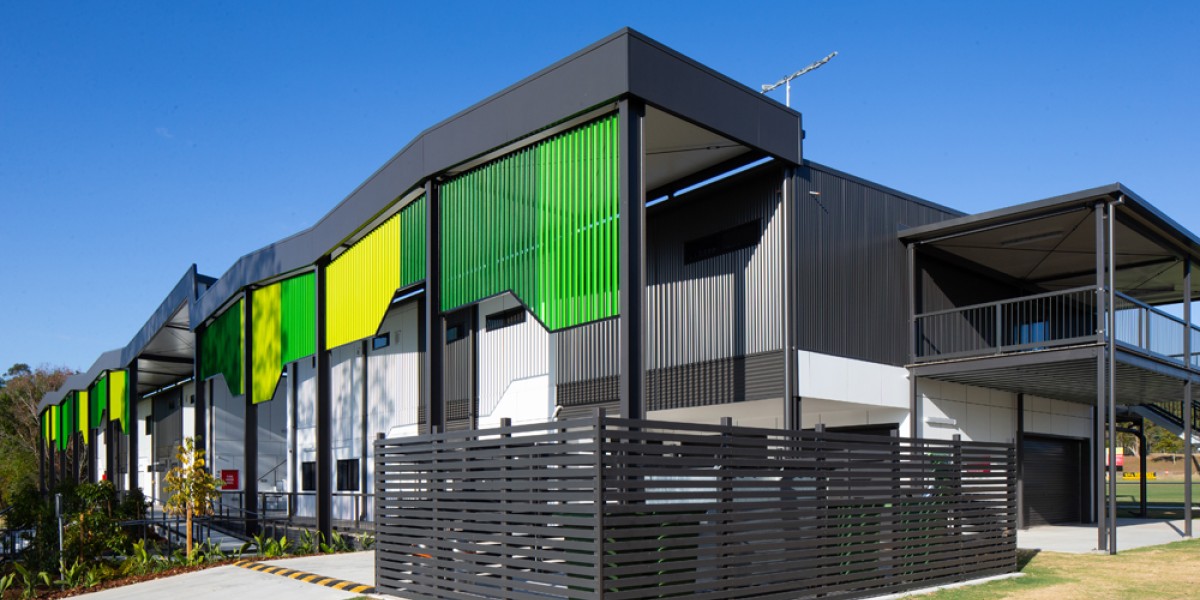 Modular Building with Green Facade, Grey Awnings and Fencing