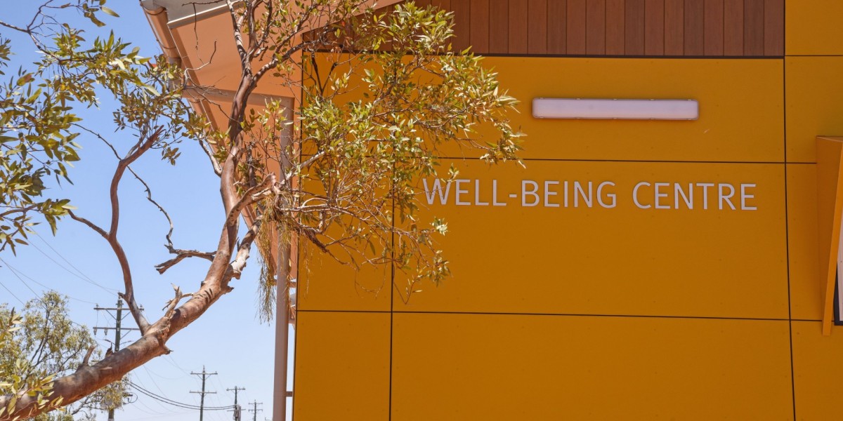 Exterior of Orange Modular Building with "Wellness Centre" on the Wall