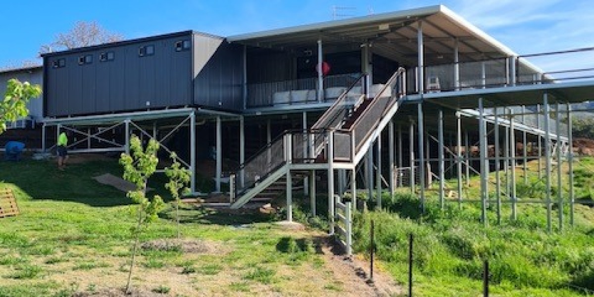 Exterior Modular Building on Grassy Field with Stairway