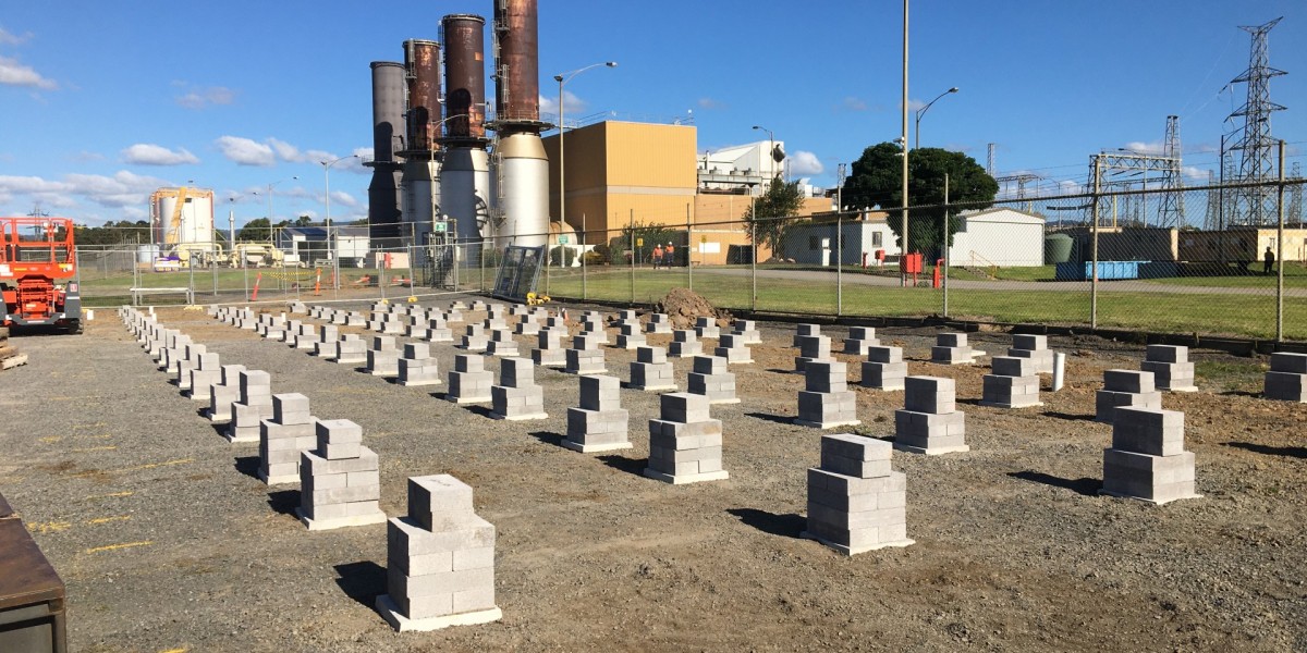 Foundation Bricks with Metal Fencing in Front of Power Station