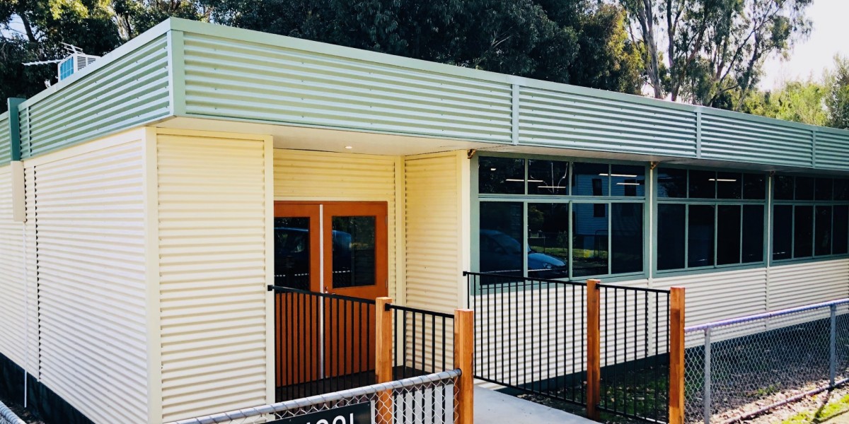 Fenced Modular School Building with Corrugated Metal Cladding, Windows and Double Door