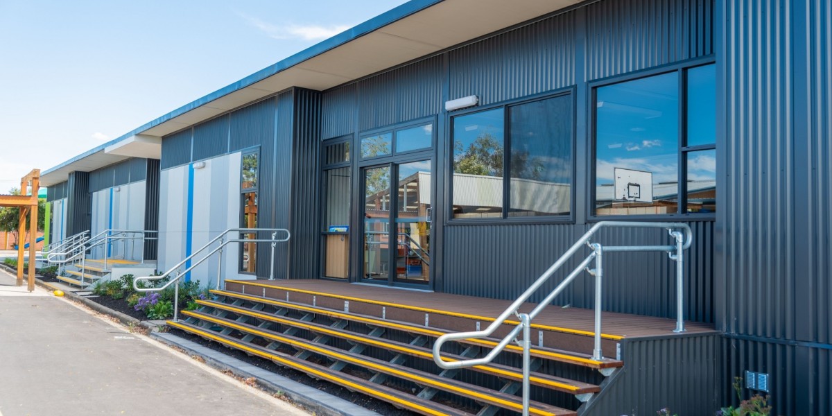 Exterior School Building with Corrugated Steel Cladding and Stairway