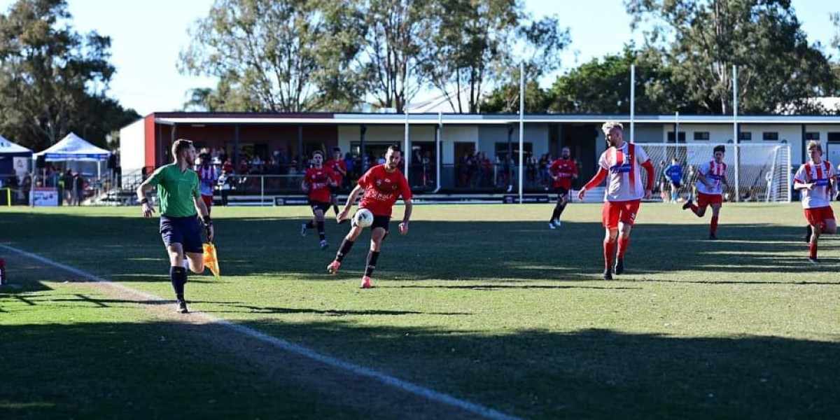 Male Soccer Players on Field Mid-Game