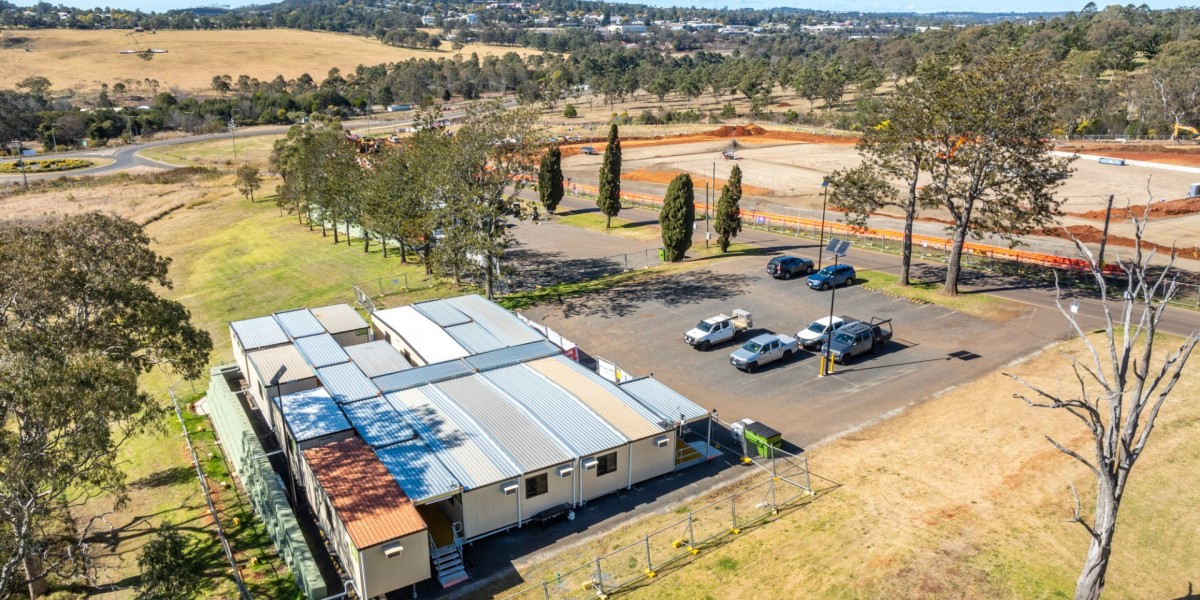 An aerial view of the site compound with empty countryside in the background