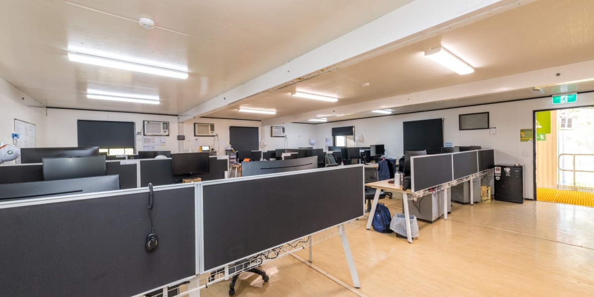 An internal view of one of the John Holland offices within the site building showing the desks and computers