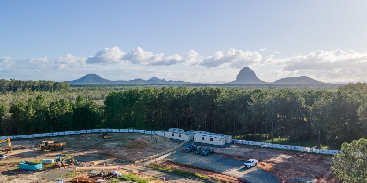 An aerial photo of the Deluca site, with the glasshouse mountains in the background.