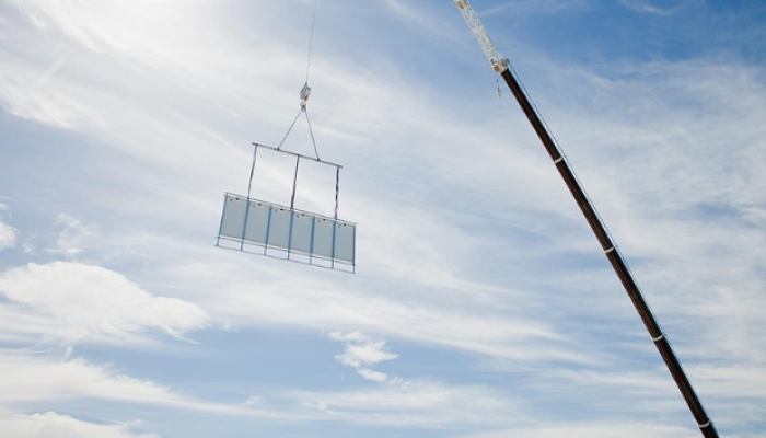 Lifting hireable solar panels on Ausco buildings