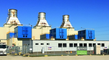 Demountable Buildings and Metal Fencing in Front of Power Station