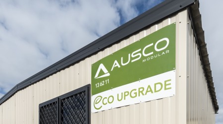 Ausco Eco Upgrade Signage on Beige Building