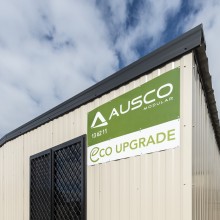 Ausco Eco Upgrade Signage on Beige Building