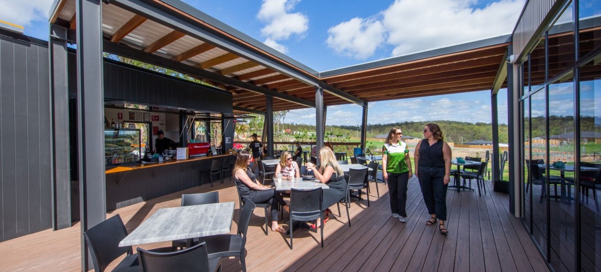 Outdoor Deck with Canteen, Tables and Chairs and People in Walkway