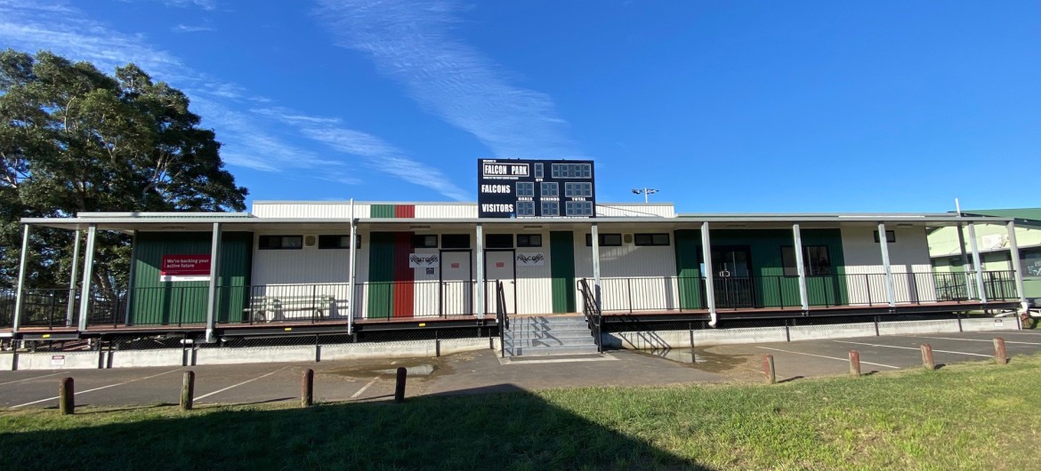 Demountable Sports Building Facing Sports Grounds with Green and Red Paint