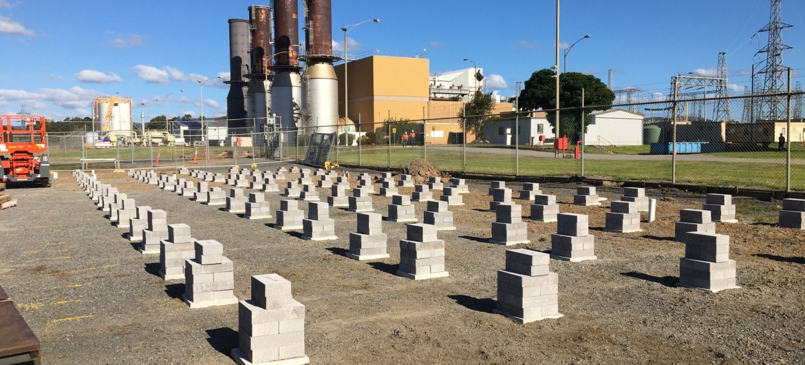 Foundation Bricks with Metal Fencing in Front of Power Station