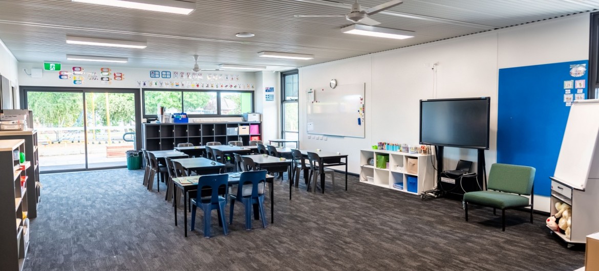 Interior Classroom with Whiteboard, Desks and Chairs