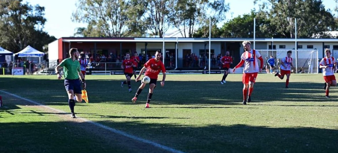 Male Soccer Players on Field Mid-Game