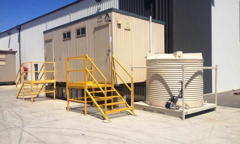 Water tanks in situ with a toilet building