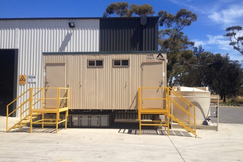 Water tanks supporting an Ausco toilet building